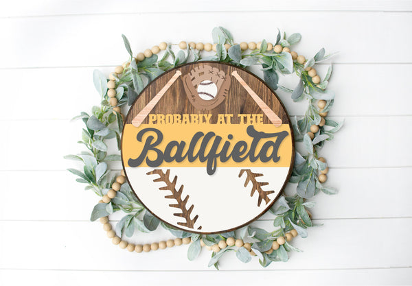 Probably at the Ballfield  - Round  Wood Door Sign | Hanger | ChicaTiza