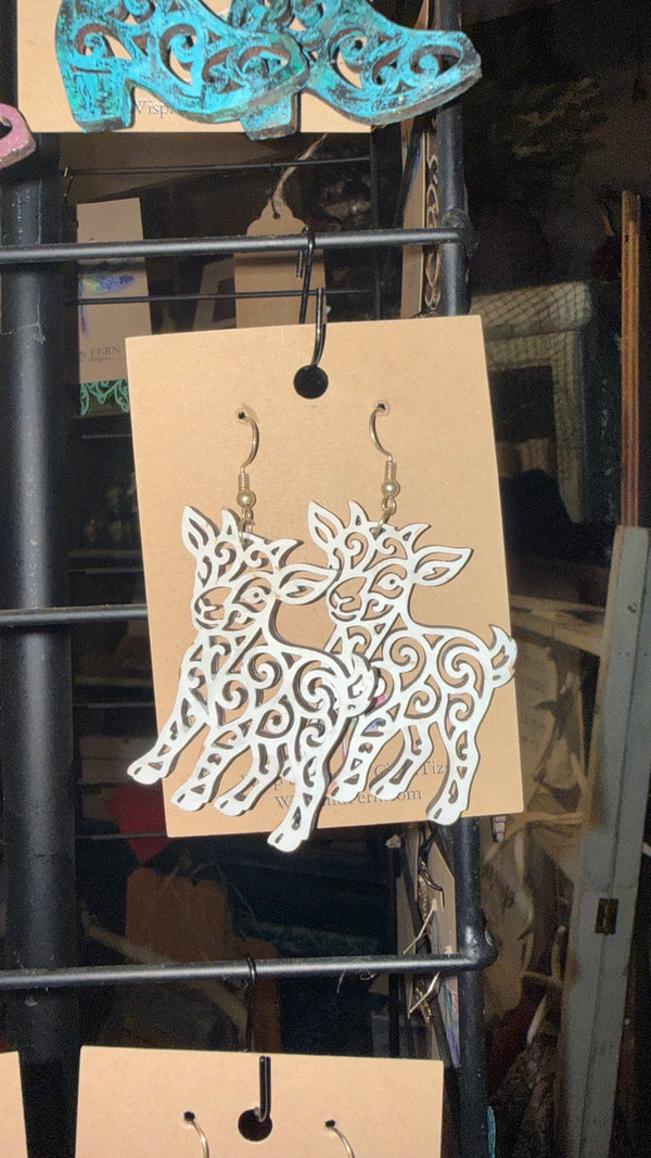White Filigree Goat Earrings — original photograph