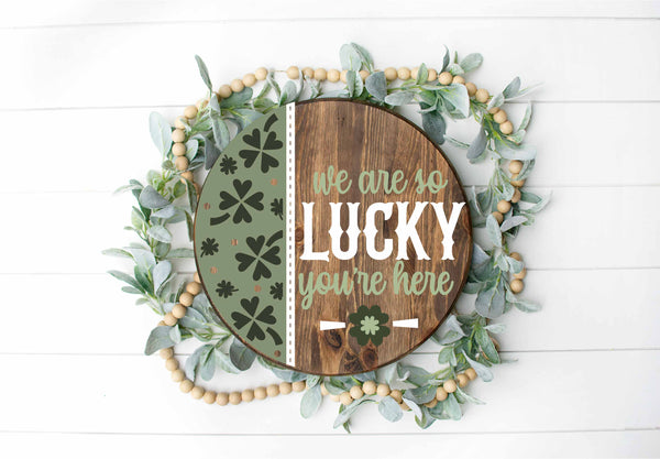 We are so Lucky You’re Here - Round Wood Door Sign | Hanger | ChicaTiza