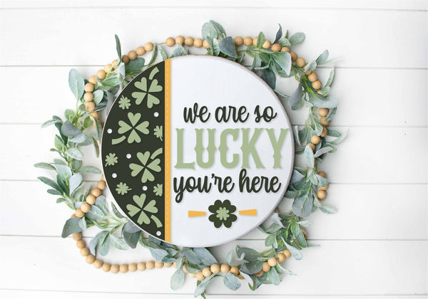 We are so Lucky You’re Here  - Round  Wood Door Sign | Hanger | ChicaTiza