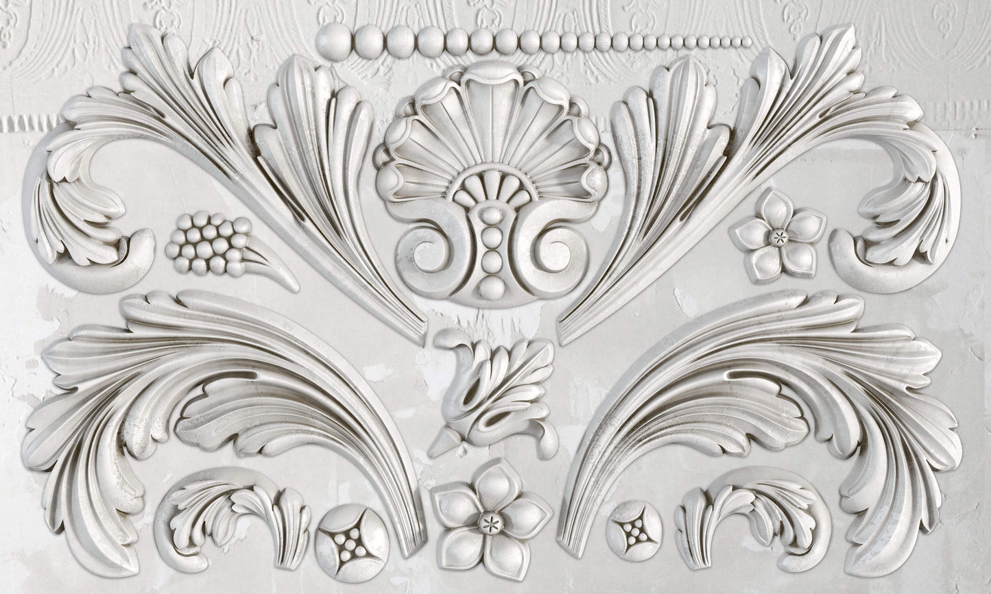 A silicone mould with baroque-inspired floral and scroll details.