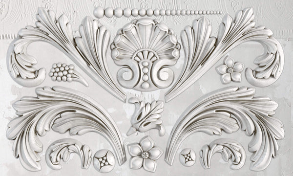 A silicone mould with baroque-inspired floral and scroll details.