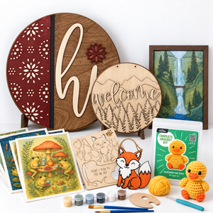 ChicaTiza Hi and layered mountain wood signs, wood canvas and fox craft kit alongside Casa Araceli painting scenes and a Bucilla crochet kit.