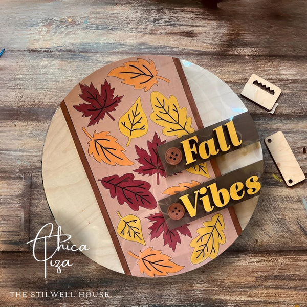 Finished Fall Vibes layered wood door hanger with autumn leaves and button accents