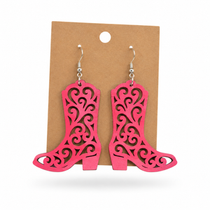 Hand-painted hot pink filigree cowboy boot earrings on a kraft display card