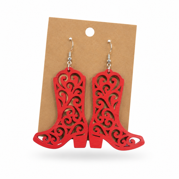 Hand-painted red filigree cowboy boot earrings on a kraft display card