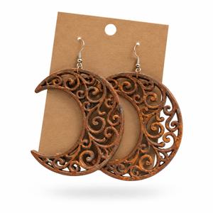 Rusty Iron Crescent Moon Filigree Earrings (3-inch) displayed on a kraft earring card
