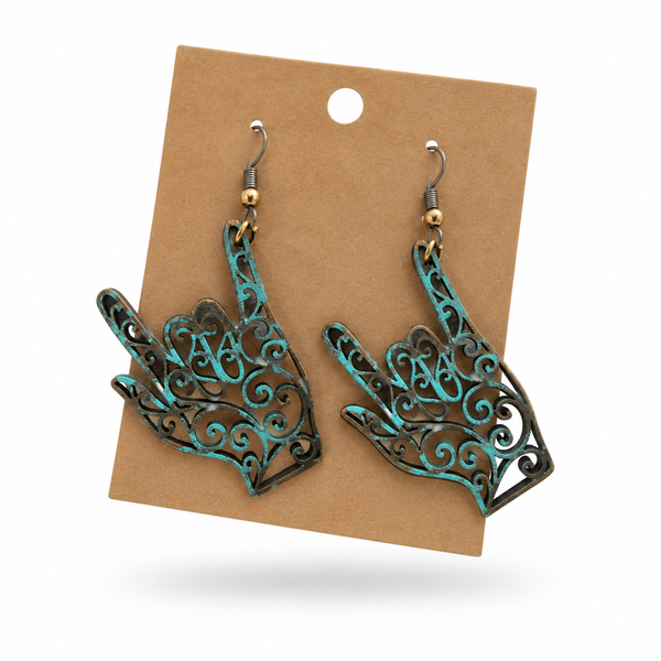 Rusty Patina ASL “I Love You” Hand Earrings displayed on a kraft earring card
