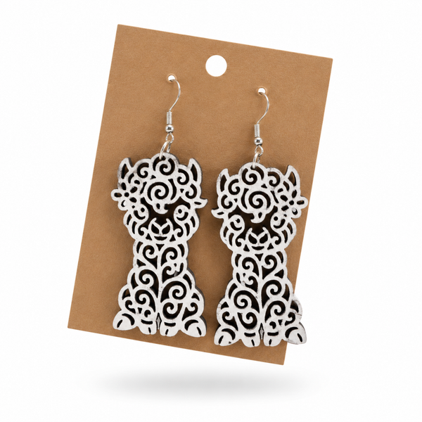 White Llama Filigree Earrings displayed on a kraft earring card