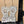White Llama Filigree Earrings — original photograph