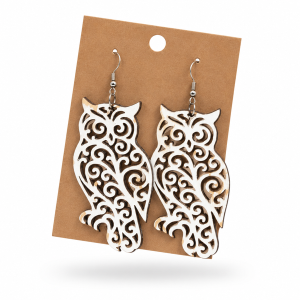 Hand-painted white filigree owl earrings by Wisp & Fern
