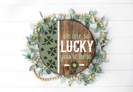 We are so Lucky You’re Here  - Round  Wood Door Sign | Hanger | ChicaTiza