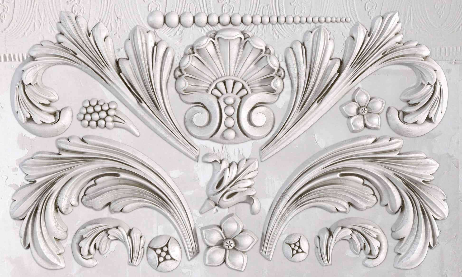 A silicone mould with baroque-inspired floral and scroll details.